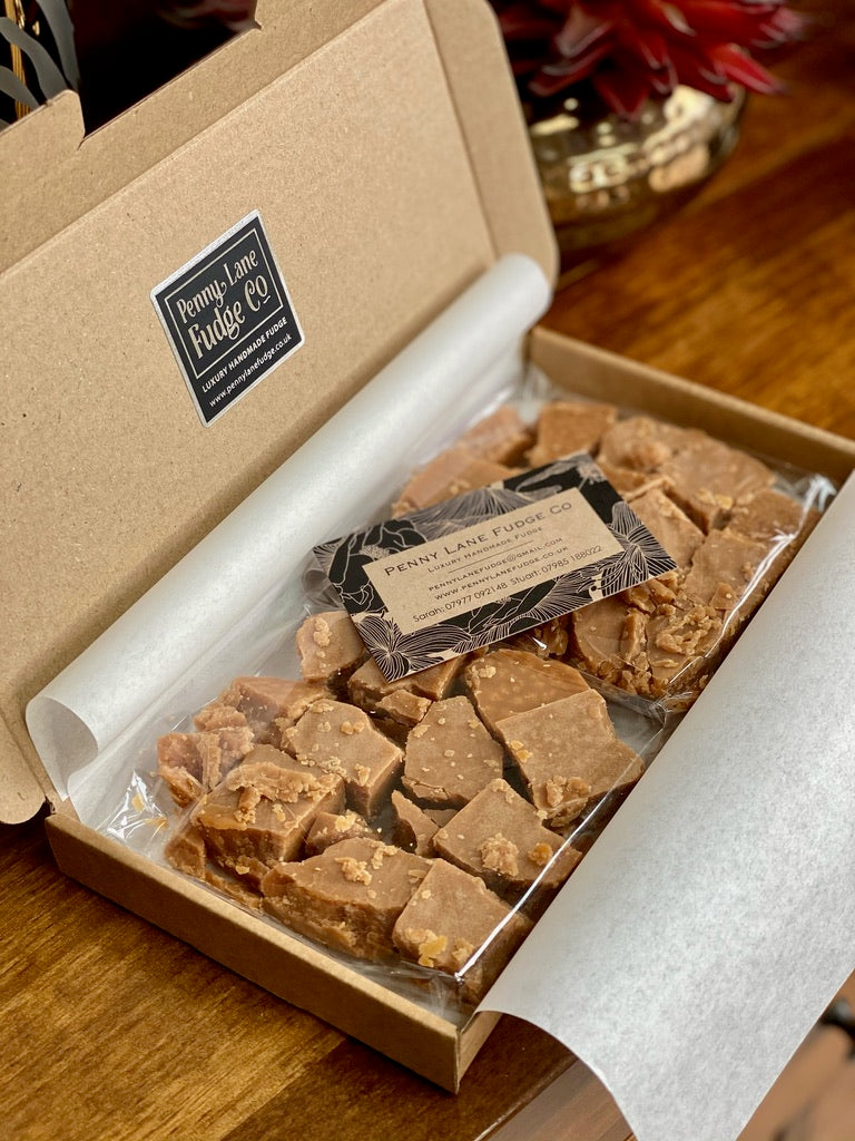 Box of scottish tablet with a label on a wooden surface