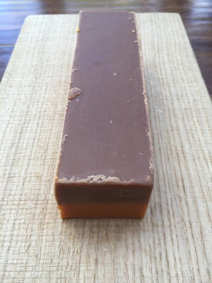 Rich chocolate fudge slice infused with vibrant orange twist, smooth and indulgent.