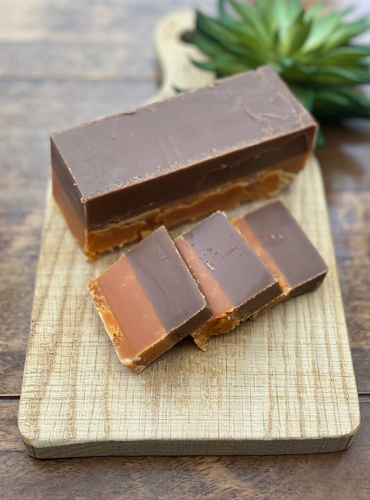 Rich chocolate fudge slice infused with vibrant orange twist, smooth and indulgent