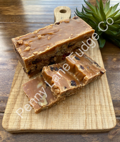 Fudge slices on a wooden cutting board with 'Penny Lane Fudge' branding.