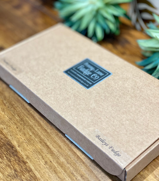 Medium gift-wrapped box containing two handcrafted fudge flavours, neatly presented.