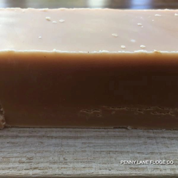 Close-up of a block of fudge with 'Penny Lane Fudge Co' branding.